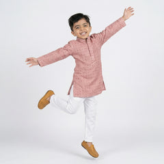 Boy wearing pink embroidered kurta with white pajama traditional ethnic wear for kids