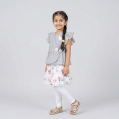 Girl wearing grey pinstripe peplum top with butterfly detail and floral layered skirt elegant party wear outfit for kids