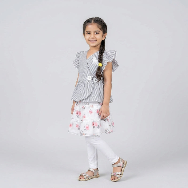 Girl wearing grey pinstripe peplum top with butterfly detail and floral layered skirt elegant party wear outfit for kids