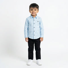 Boy wearing light blue formal shirt with black pants stylish kids outfit for parties and casual wear