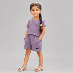 Little girl wearing beige cotton t-shirt and matching shorts co-ord set with heart detail casual summer outfit for kids