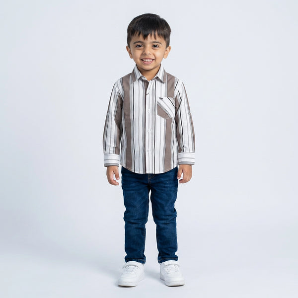 Young boy wearing striped shirt with denim jeans smart casual kids outfit