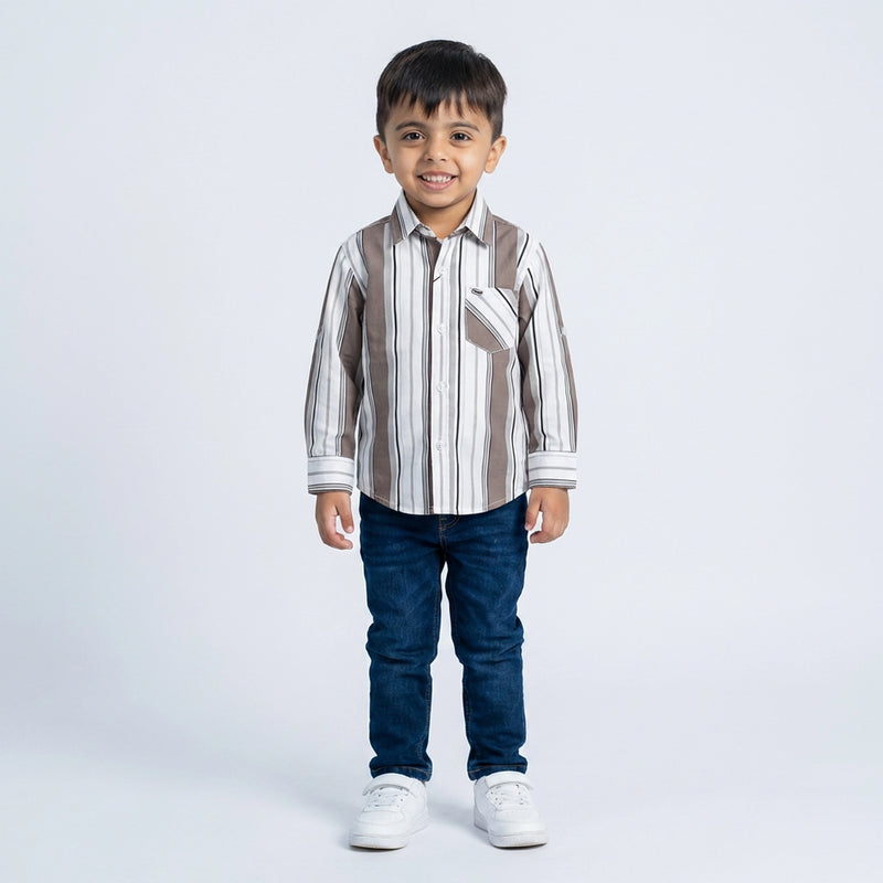 Young boy wearing striped shirt with denim jeans smart casual kids outfit