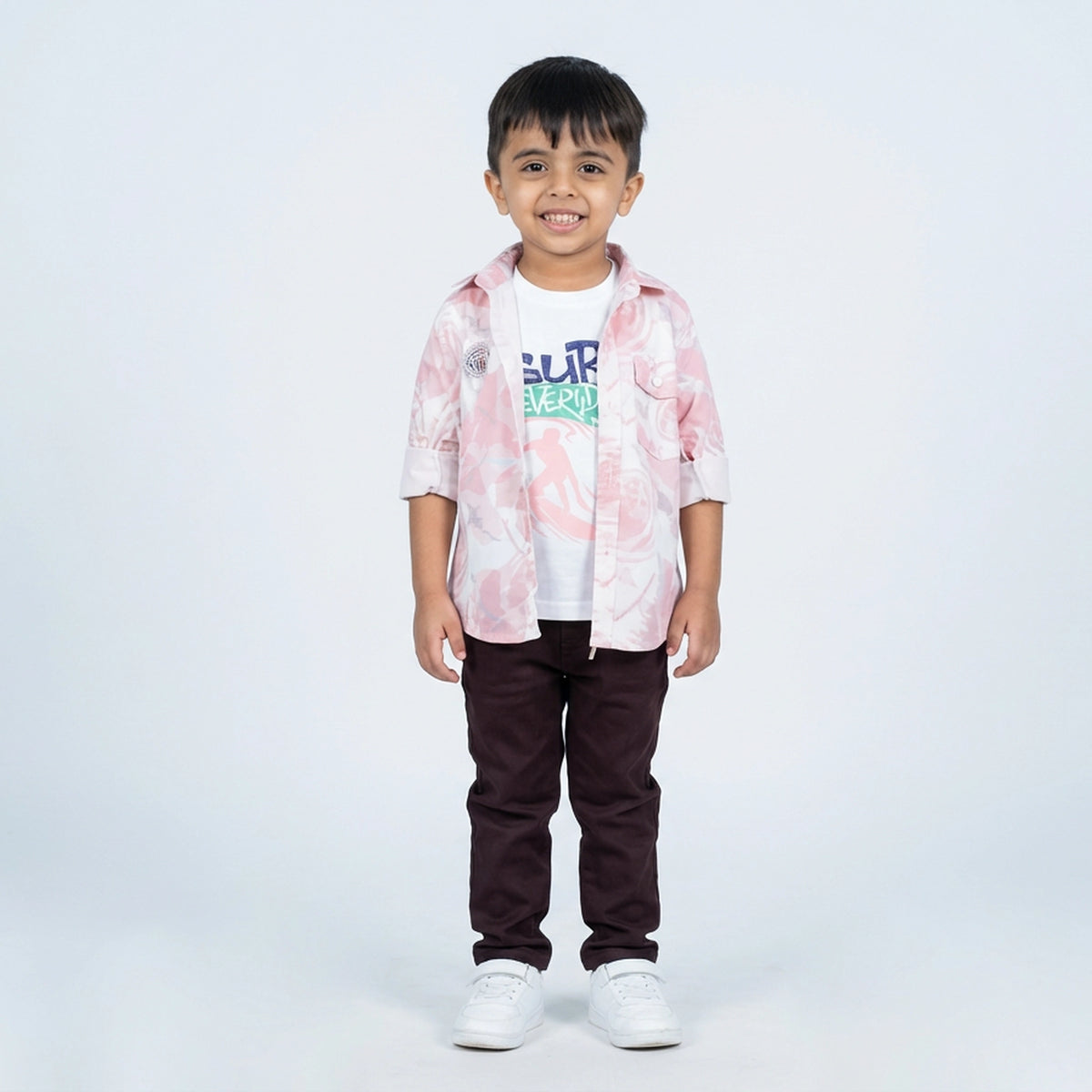 Young boy wearing printed shirt with graphic t-shirt and casual pants kids 3 piece outfit