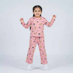 Little girl wearing pink cartoon printed full sleeve night suit set with matching pajama pants for kids sleepwear