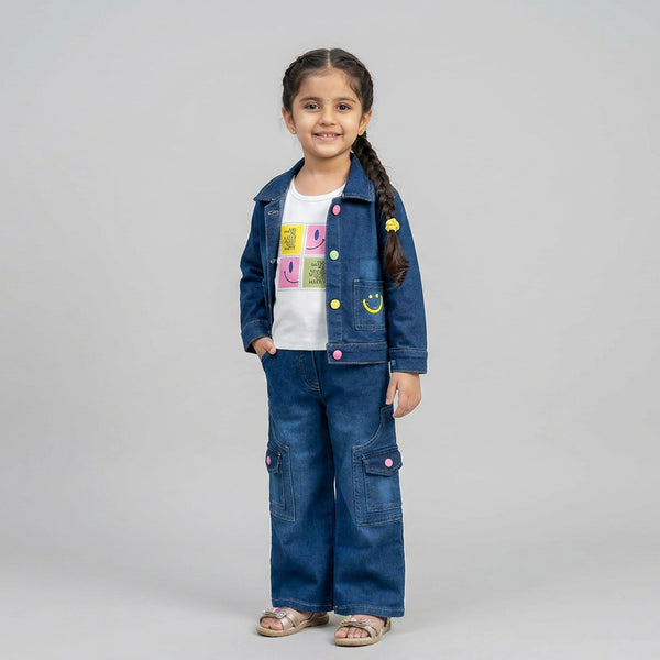Young girl wearing a denim jacket and pants on a gray background