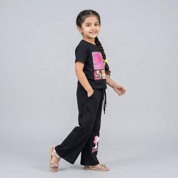 Little girl wearing Barbie graphic t-shirt with matching flared pants co-ord set casual outfit for kids
