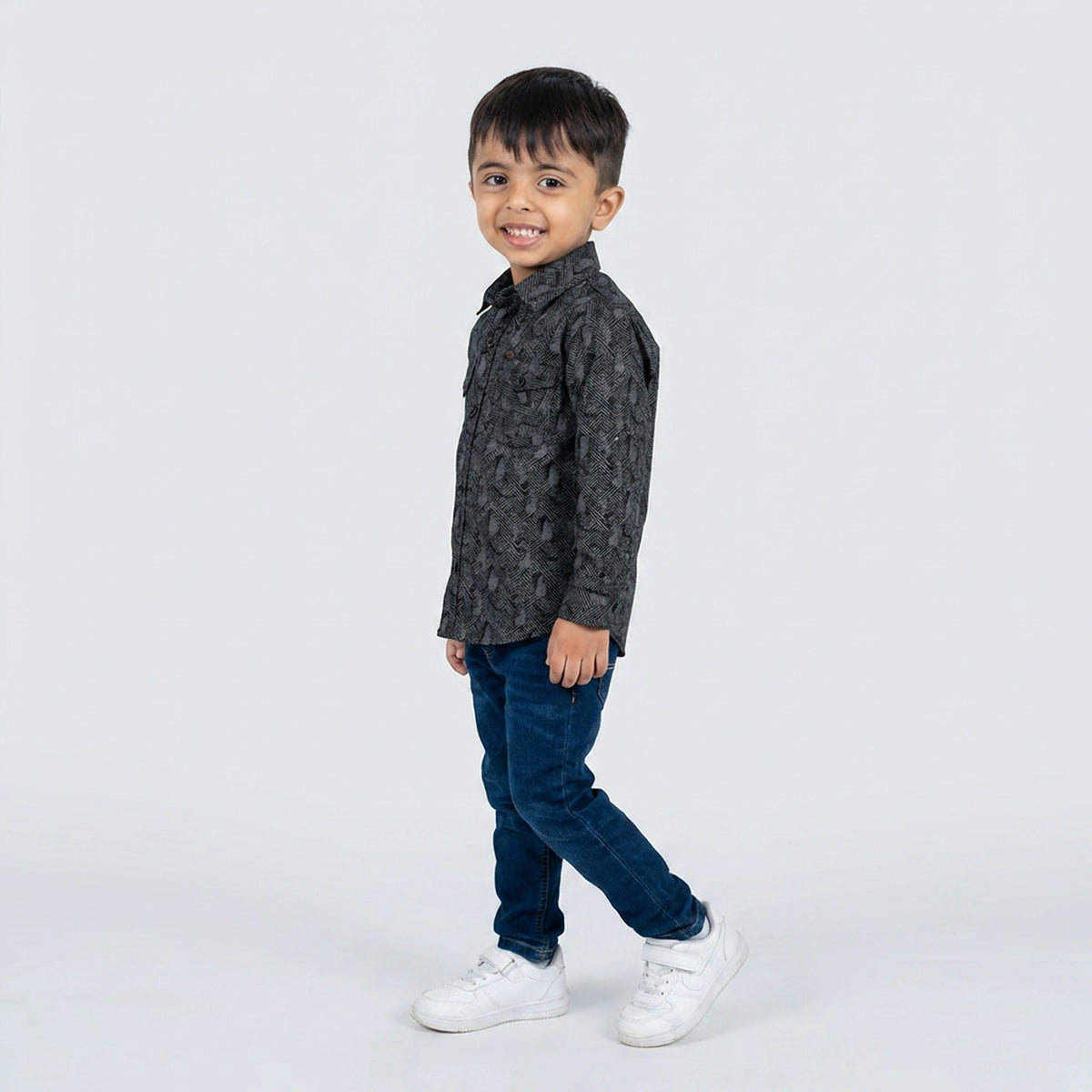 Young boy wearing grey printed shirt with denim jeans smart casual kids outfit