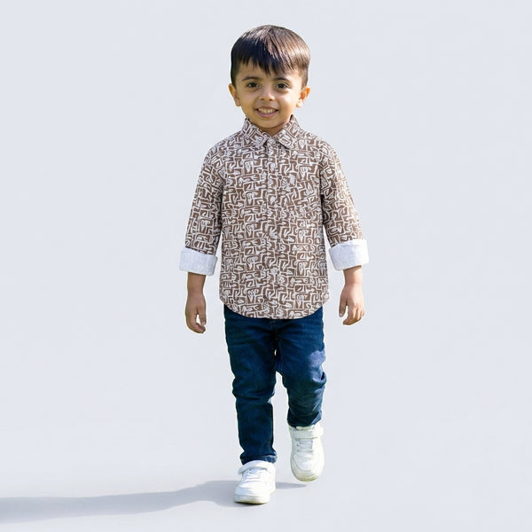 Young boy wearing green printed shirt with denim jeans casual kids outfit