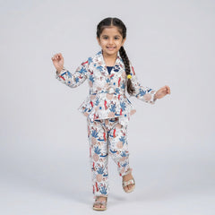 Girl wearing printed peplum co-ord set with blazer style top and matching pants stylish party wear outfit for kids