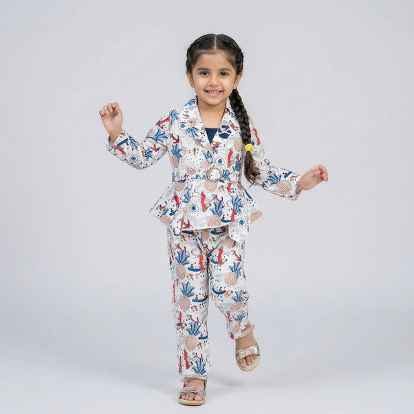 Girl wearing printed peplum co-ord set with blazer style top and matching pants stylish party wear outfit for kids