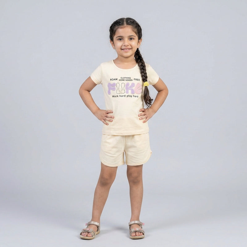 Little girl wearing printed t-shirt and matching shorts co-ord set casual summer outfit for kids