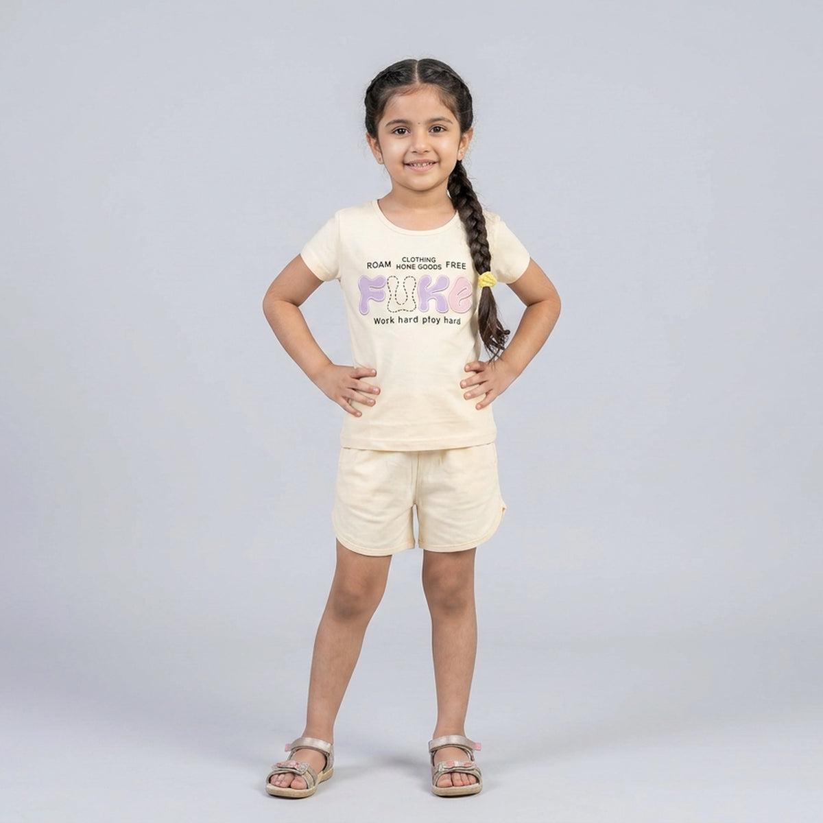 Little girl wearing printed t-shirt and matching shorts co-ord set casual summer outfit for kids