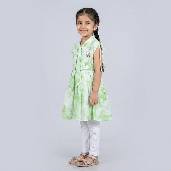 Girl wearing mint green floral A-line dress with white leggings stylish casual and party wear outfit for kids
