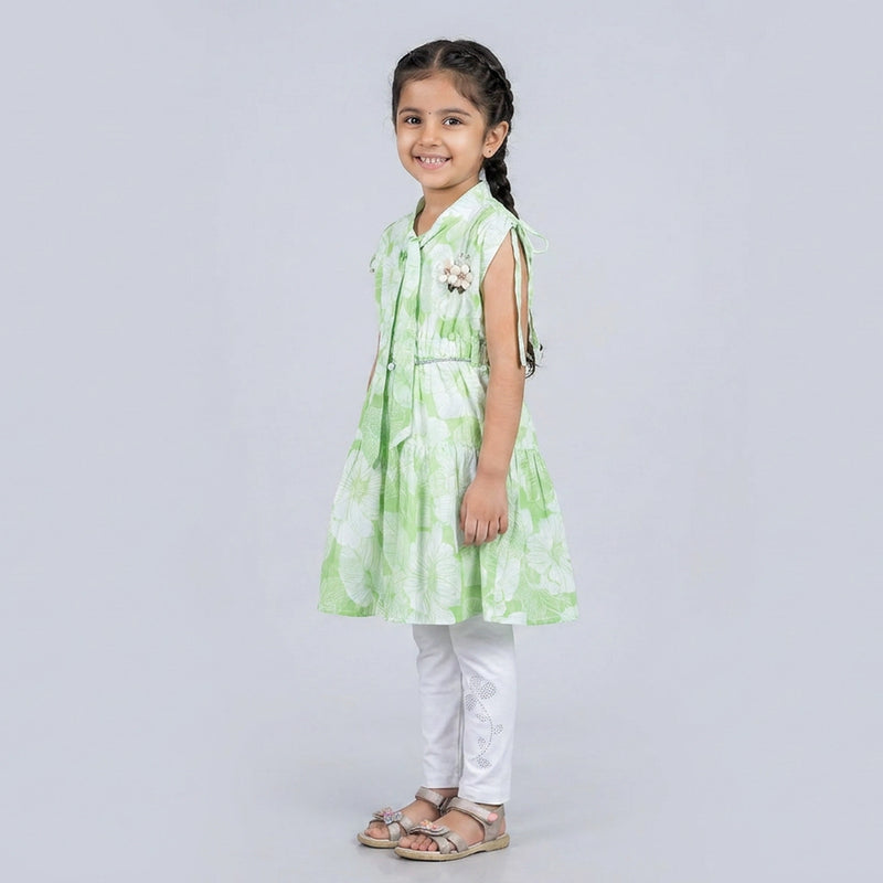 Girl wearing mint green floral A-line dress with white leggings stylish casual and party wear outfit for kids