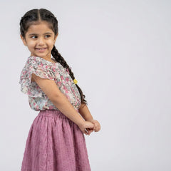 Girl wearing floral ruffle sleeve top with pink flared skirt stylish party wear outfit for kids fashionable girls co-ord set