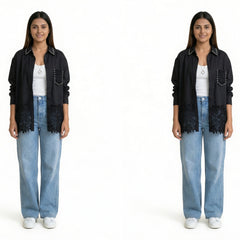 A woman wearing a black button-down shirt with lace detailing and stud accents, layered over a white top, paired with light blue wide-leg jeans and white sneakers.