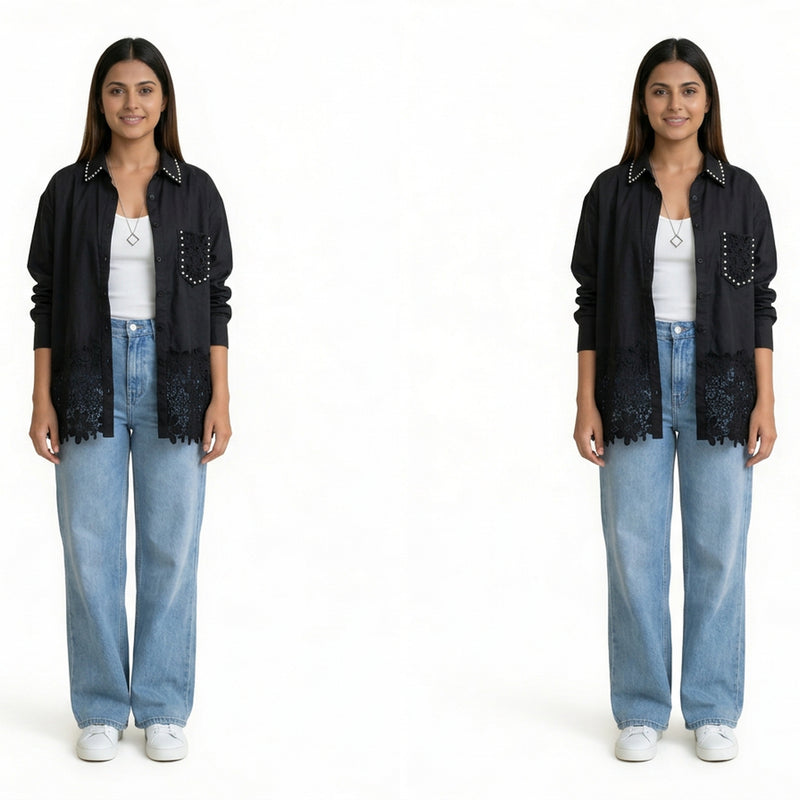A woman wearing a black button-down shirt with lace detailing and stud accents, layered over a white top, paired with light blue wide-leg jeans and white sneakers.