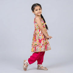 Young girl wearing a colorful traditional outfit on a light gray background