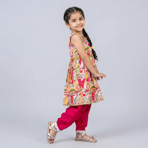 Young girl wearing a colorful traditional outfit on a light gray background