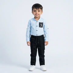 Young boy wearing light blue shirt with graphic t-shirt and black jogger pants kids casual 3 piece outfit