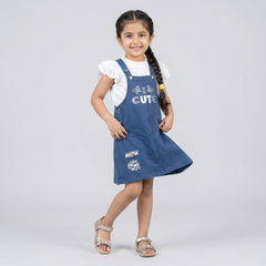 Girl wearing blue pinafore dress with white ruffle sleeve top cute kids casual outfit dungaree style dress for girls