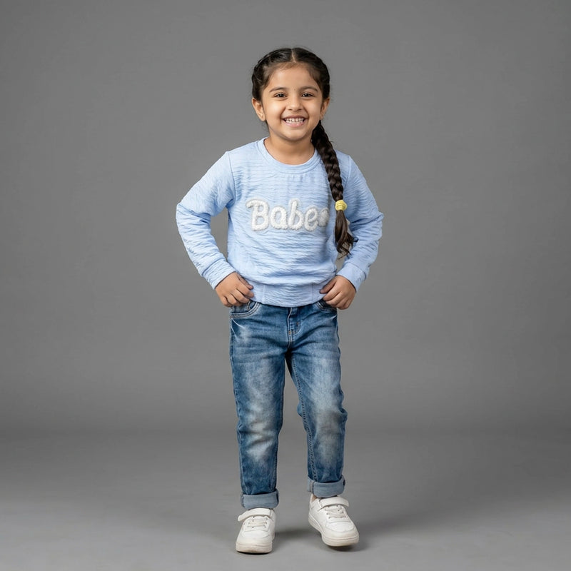 girl wearing a light blue printed Top - girl top printed