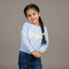 girl wearing a light blue printed Top - girl top printed