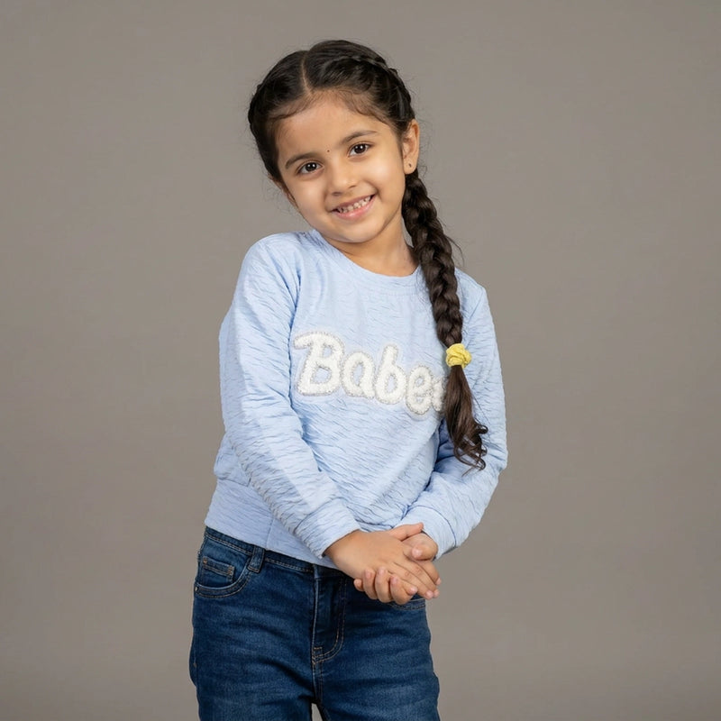 girl wearing a light blue printed Top - girl top printed