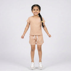 Little girl wearing cotton t-shirt and matching shorts co-ord set casual summer outfit for kids