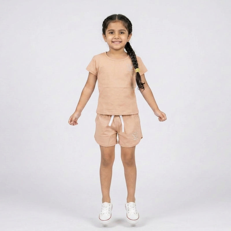 Little girl wearing cotton t-shirt and matching shorts co-ord set casual summer outfit for kids
