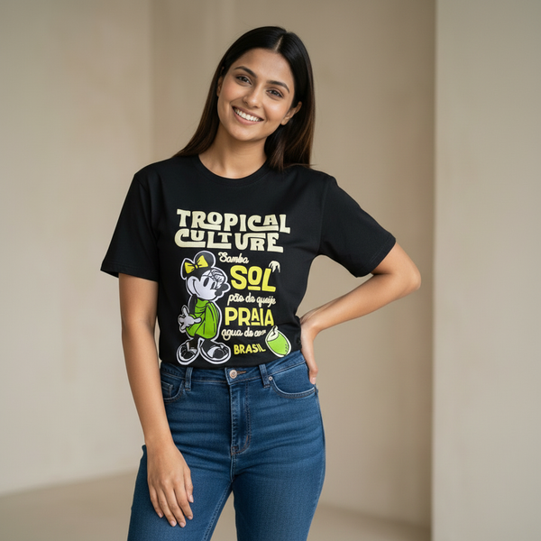 Woman wearing black ‘Tropical Culture Brazil’ graphic t-shirt with cartoon character and yellow-green print, paired with blue jeans.