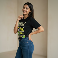 Woman wearing a black t-shirt with colorful graphics and text, standing against a plain background