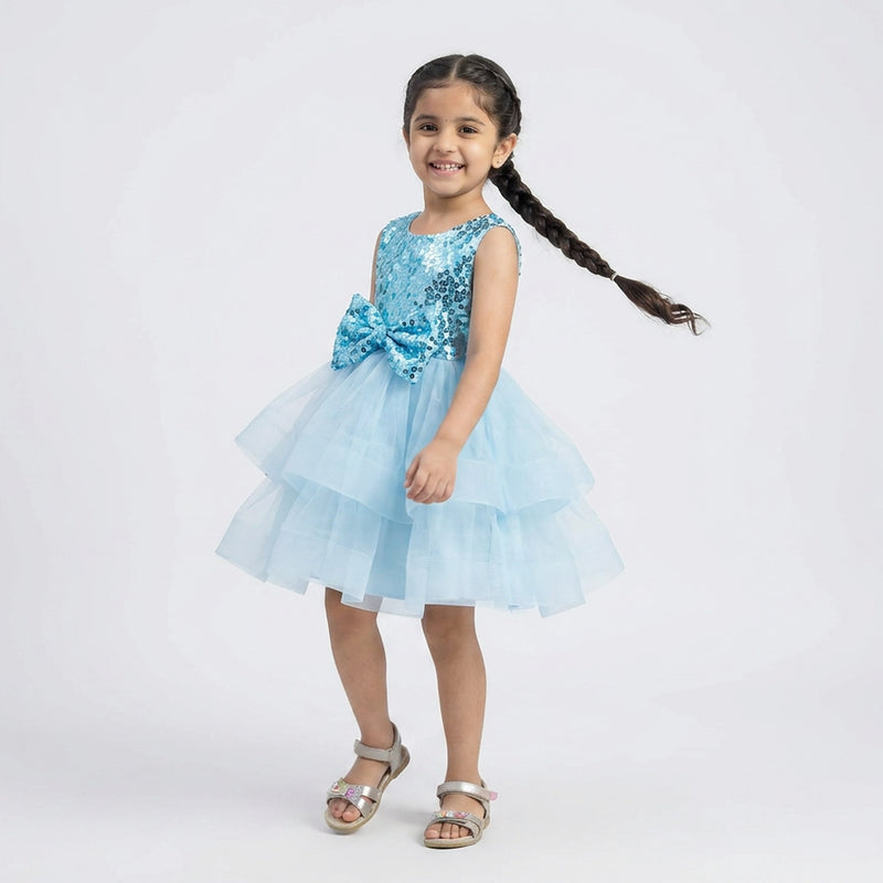 Little girl wearing sky blue sequin layered tulle princess party dress with bow detail for birthday and wedding occasions